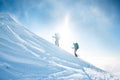 Climbers climb to the top of the mountain in winter Royalty Free Stock Photo