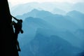 Climber on mountain range background Royalty Free Stock Photo