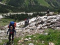 Climbers are crossing a mountain river. Caucasus, Russia.