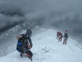 Climbers Enter Dark Snowy Abyss