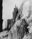 Climbers on glacier with skyscrapers in background