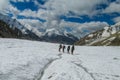 Climbers on glacier traver mountain route attached to the alpinist rope Royalty Free Stock Photo