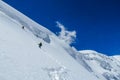 Climbers on glacier traver mountain route attached to the alpinist rope Royalty Free Stock Photo