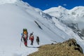 Climbers on glacier traver mountain route attached to the alpinist rope Royalty Free Stock Photo