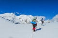 Climbers on glacier traver mountain route attached to the alpinist rope Royalty Free Stock Photo
