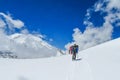 Climbers on glacier traver mountain route attached to the alpinist rope