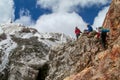 Climbers on glacier traver mountain route attached to the alpinist rope Royalty Free Stock Photo