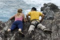 Climbers looking over cliff Royalty Free Stock Photo