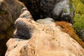 Climbers metal ladder via ferrata. Iron twisted rope fixed in block by screws snap hooks. The rope end anchored into sandstone Royalty Free Stock Photo