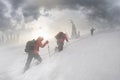 Climbers in mountain snowfall