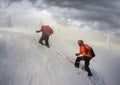 Climbers in mountain snowfall