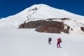 Climbers pass a glacier on the way to Mount Elbrus