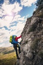 Climbers reaches the top of mountain peak.