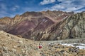 Climbers resting on a path after descending from the top of Stok Kangri peack