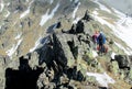 Climbers on the rock and snow alpinist route Royalty Free Stock Photo