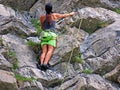 Climbers on rocky cliffs above Lake Melchsee in the Swiss Alps and in the Uri Alps massif, Melchtal - Switzerland Royalty Free Stock Photo