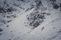 Climbers on a snowy rock