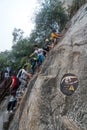 Climbers tackling steep stone stairs on Huashan mountain Royalty Free Stock Photo