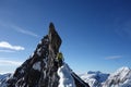 Climbers walking on narrow mountain ridge covered by snow Royalty Free Stock Photo