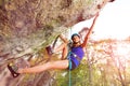 Climbing alpinist practicing outdoors at sunny day