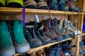 Climbing boots in an outdoor shoe shelf