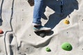 Climbing a boulder wall Royalty Free Stock Photo