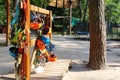 Climbing equipment - colorful helmets hanging on a board in a rope park.