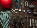 Climbing equipment on dark wooden background, top view Royalty Free Stock Photo