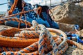 Climbing equipment. Mountaineering gear on rock. Safety rope, carabiner, and boots. Royalty Free Stock Photo