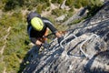 A man climbing a ferrata route in Calcena, Spanish mountains