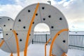 Climbing frame on a playground against cloudy sky