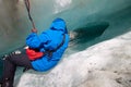 Climbing through an ice cave on Franz Jozef Glacier