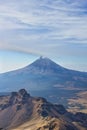 Climbing the Iztaccihuatl volcano, Popocatepetl volcano in Mexico, Tourist on the peak of high rocks. Sport and active life Royalty Free Stock Photo
