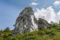 Climbing on the Jurassic rock. An atmospheric view of Jura. Blue sky and clouds. Royalty Free Stock Photo