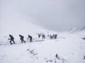 Climbing mighty Himalayan Mountain during a snow storm