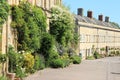 In the distance hanging baskets in the village Cirencester in England. Royalty Free Stock Photo