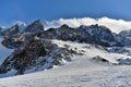 Climbing the rocky peaks of the snowy mountains.