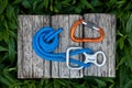 Climbing rope with a descender and a carabiner. Royalty Free Stock Photo