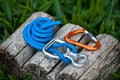 Climbing rope with a descender and a carabiner. Royalty Free Stock Photo