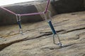 Climbing. A safety bolt threaded a rope with a carbine Royalty Free Stock Photo