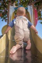 Climbing The Slide Royalty Free Stock Photo