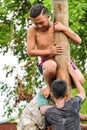 Climbing slippery pole competition or Panjat Pinang indonesian traditinal games