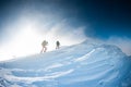 Climbers climb to the top of the mountain in winter Royalty Free Stock Photo