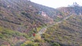 Climbing stairs to the top of the hill to see the beauty of Lake Kelimutu