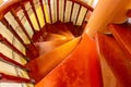 Climbing traditional wooden staircase spiral staircase with railing closeup