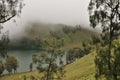 Climbing the volcano Semeru, Indonesia. Clouds obscured the crater and green valley Royalty Free Stock Photo