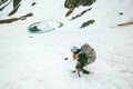 Climbing woman with backpack and ice axe mountaineering Royalty Free Stock Photo