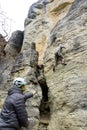 Climbs the rock tied to the rope Royalty Free Stock Photo