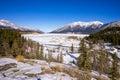 Winter Landscape with snow, mountains, frozen lake and river inflows Royalty Free Stock Photo