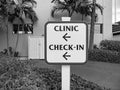 Clinic check-in inscription on sign post. Navigation sign. Wayfinding concept